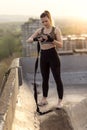 Woman wrapping hands in bandages before workout