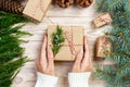 Woman wrapping modern Christmas gifts presents at home Royalty Free Stock Photo