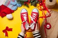 Woman wrapping red gumshoes