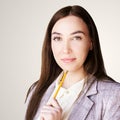 Woman write with pencil and notepad. Student think about university Royalty Free Stock Photo