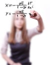 Woman writes the formula Royalty Free Stock Photo