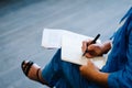 A woman writes a pen on a blank sheet of paper. Place for text. hands of a businessman in a suit signing or writing a document on Royalty Free Stock Photo