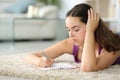 Woman writing in agenda on the floor Royalty Free Stock Photo