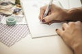 Woman writing in a baby book