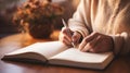 A woman writing in a book with her pen, AI Royalty Free Stock Photo