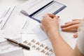 Woman writing checks from checkbook Royalty Free Stock Photo