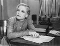 Woman writing at desk