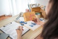 Woman is writing down the customer\'s details and addresses on the notebook