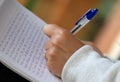 Woman writing her memoirs Royalty Free Stock Photo