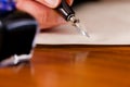 Woman writing a letter with pen and ink Royalty Free Stock Photo