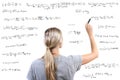 woman writing mathematical equations Royalty Free Stock Photo