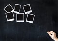 Woman writing on a blackboard with blank retro photo frames