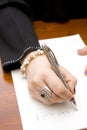 Woman writing note in Arabic