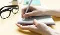 notes on desk, close up of hand Royalty Free Stock Photo