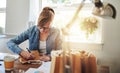 Woman Writing Notes on Paper Gift Bag on the Table Royalty Free Stock Photo