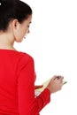 Woman writing notes and planning her schedule Royalty Free Stock Photo