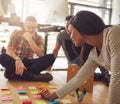 Woman writing on notes for workers on floor Royalty Free Stock Photo