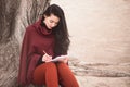 Woman writing outdoors Royalty Free Stock Photo