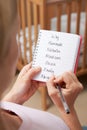 Woman Writing Possible Names For Baby Girl In Nursery Royalty Free Stock Photo