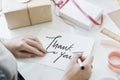 Woman writing a Thank You card Royalty Free Stock Photo