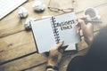 Woman written business ethics text on notepad on office desk