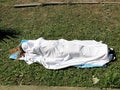 Woman's body under the bedsheet