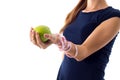 Woman's hand with centimeter around it holding an apple Royalty Free Stock Photo