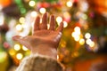 Defocused ligths of decorated Christmas tree in the rural house interior. Blurred New year festive background. Royalty Free Stock Photo