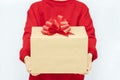 Woman& x27;s hand holding a gift box with a bow. Delivery Express, Christmas Sale. Online shopping. New Year gifts. Royalty Free Stock Photo