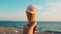 a woman& x27;s hand holds a waffle cone with a beautiful stunning multicolored ice cream on a sea background. Ai. Royalty Free Stock Photo
