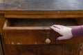 a woman& x27;s hand opens a drawer of an old chest of drawers Royalty Free Stock Photo