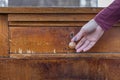 a woman& x27;s hand opens a drawer of an old chest of drawers Royalty Free Stock Photo