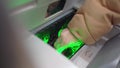 a woman's hand puts banknotes in an atm to replenish the account.