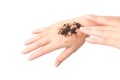 Woman& x27;s hand with scrub coffee grounds on skin hand and arm, bea