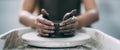 The woman& x27;s hands close up, the masterful studio of ceramics works with clay on a potter& x27;s wheel. Royalty Free Stock Photo