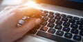 Woman& x27;s hands pressing keys on a laptop keyboard trying to access data