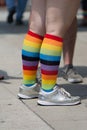 A woman& x27;s legs with rainbow socks and silver shoes at San Diego gay pride parade