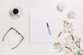 Woman's table, desk or workspace seen from above. Top view background with white wood and copy space