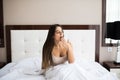 woman yawning in bed at home Royalty Free Stock Photo