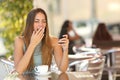 Woman yawning while is working at breakfast in a restaurant