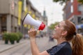 Woman yelling into a bullhorn Royalty Free Stock Photo