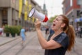 Woman yelling into a bullhorn Royalty Free Stock Photo