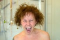 Woman yelling in frustration on a bad hair day Royalty Free Stock Photo