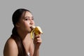 A woman with a yellow banana to make love Royalty Free Stock Photo