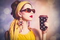 Woman in yellow clothes with coffee Royalty Free Stock Photo