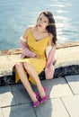 Woman in yellow dress and pink blazer Royalty Free Stock Photo