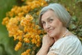 Woman with yellow flowers Royalty Free Stock Photo