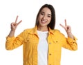 Woman in yellow jacket showing number four with her hands on white background Royalty Free Stock Photo