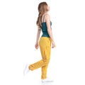 Woman in yellow pants smiling happiness goes walking Royalty Free Stock Photo