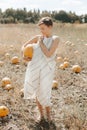 woman yellow pumpkin holds hands subject Halloween